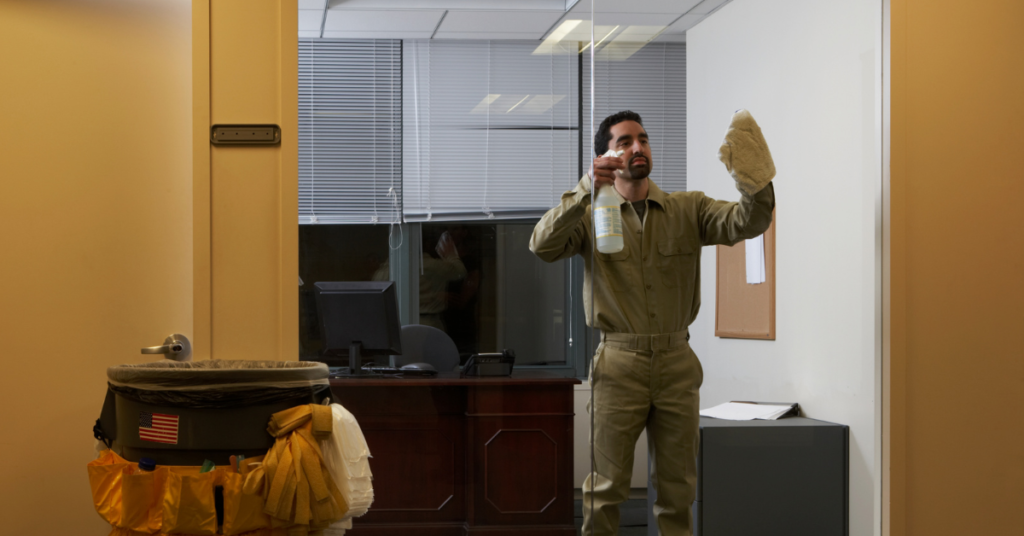 Image of professional janitors cleaning an office at night