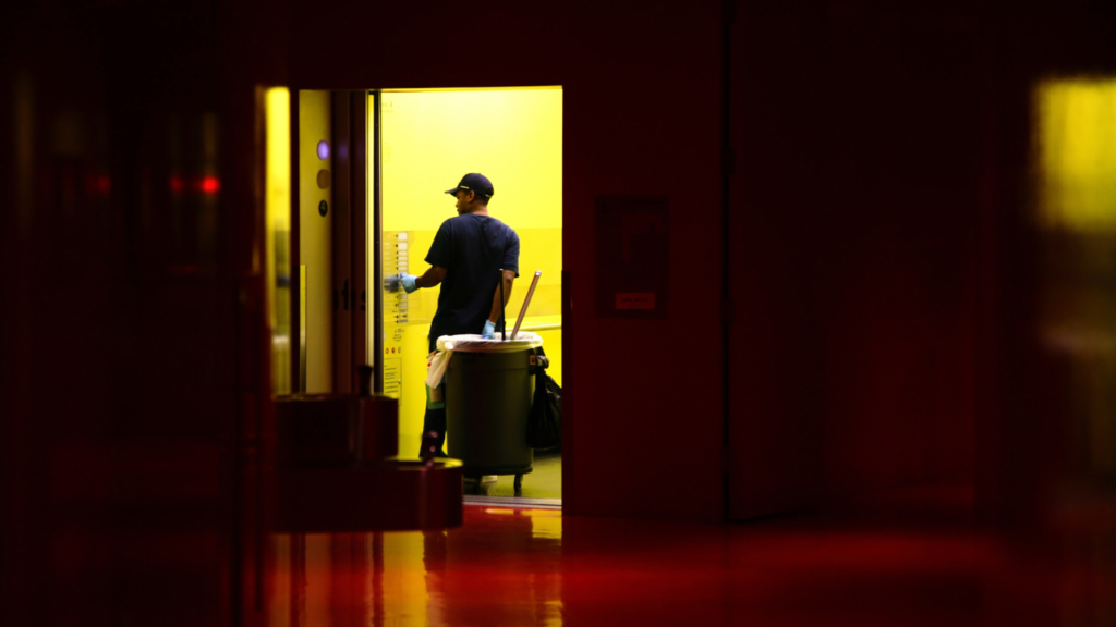 Professional janitorial services in action, maintaining impeccable cleanliness in a modern workspace.